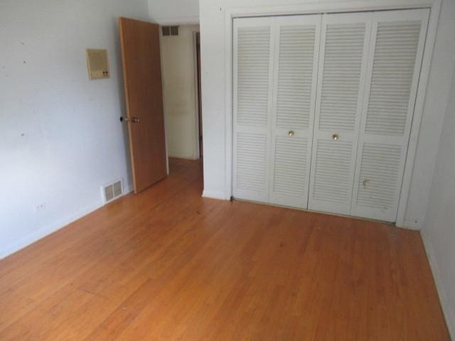 3636 Elm Ct, Flossmoor, IL 60422 - unfurnished bedroom featuring light wood-type flooring and a closet
