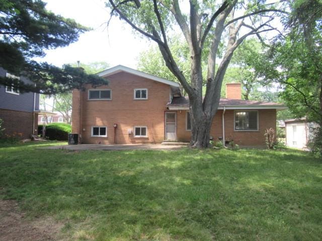 3636 Elm Ct, Flossmoor, IL 60422 - rear view of property with a chimney, a lawn, and a patio area