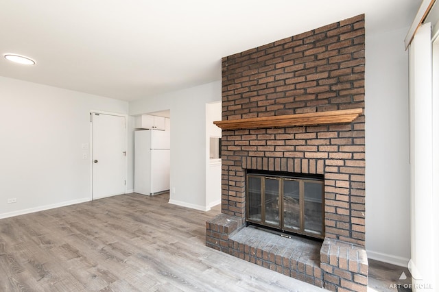 780 Buckingham Ct, Hoffman Estates, IL 60169 - unfurnished living room featuring wood finished floors and a fireplace