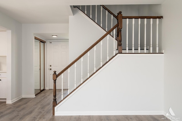 780 Buckingham Ct, Hoffman Estates, IL 60169 - stairway featuring wood finished floors and baseboards
