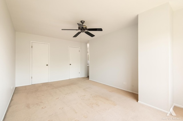 780 Buckingham Ct, Hoffman Estates, IL 60169 - unfurnished bedroom with light carpet, ceiling fan, and multiple closets