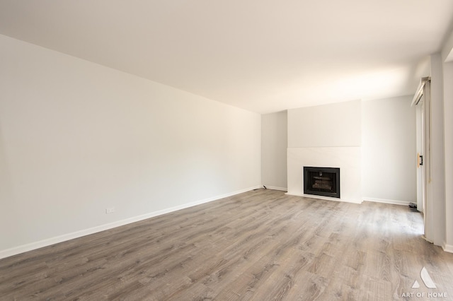 780 Buckingham Ct, Hoffman Estates, IL 60169 - unfurnished living room featuring wood finished floors and a fireplace