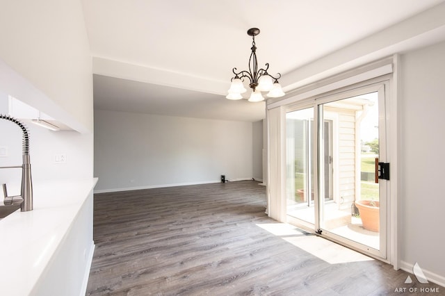 780 Buckingham Ct, Hoffman Estates, IL 60169 - unfurnished dining area with wood finished floors and a chandelier