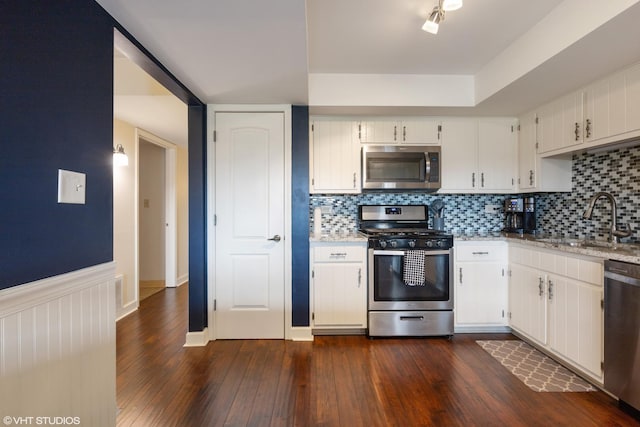 15722 Deerfield Ct Unit S-1, Orland Park, IL 60462 - kitchen with appliances with stainless steel finishes, backsplash, dark wood-style flooring, and a wainscoted wall
