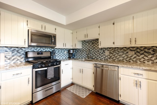 15722 Deerfield Ct Unit S-1, Orland Park, IL 60462 - kitchen with appliances with stainless steel finishes, dark wood finished floors, tasteful backsplash, and light stone counters