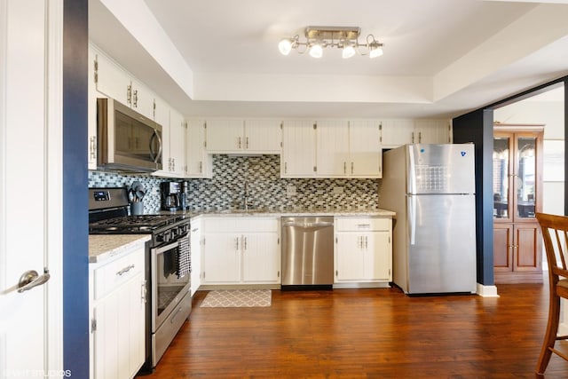 15722 Deerfield Ct Unit S-1, Orland Park, IL 60462 - kitchen featuring stainless steel appliances, a raised ceiling, backsplash, and dark wood finished floors