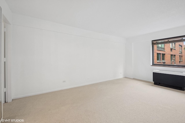 1169 S Plymouth Ct Unit 406, Chicago, IL 60605 - unfurnished room with light carpet and baseboards