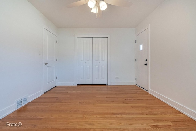 4634 N Hamlin Ave, Chicago, IL 60625 - unfurnished bedroom featuring light wood-style floors, a closet, and a ceiling fan