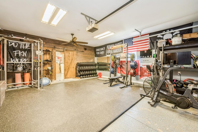 5705 Cobblestone Trl, Mchenry, IL 60050 - garage with a garage door opener, a ceiling fan, and wooden walls