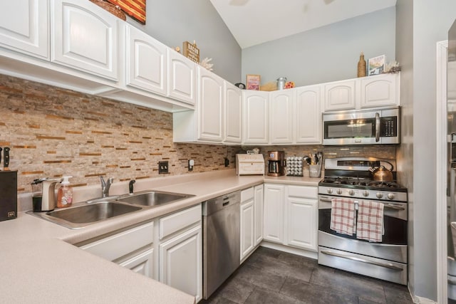 5705 Cobblestone Trl, Mchenry, IL 60050 - kitchen with appliances with stainless steel finishes, backsplash, white cabinets, light countertops, and vaulted ceiling