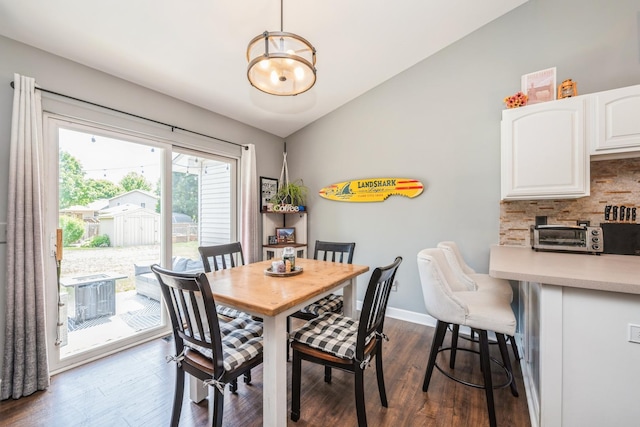 5705 Cobblestone Trl, Mchenry, IL 60050 - dining room with vaulted ceiling and dark wood-style flooring