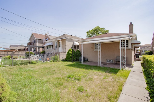 7320 N Oriole Ave, Chicago, IL 60631 - rear view of property with a chimney, brick siding, and a patio