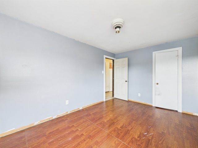 4931 S Knox Ave, Chicago, IL 60632 - unfurnished bedroom with wood finished floors and baseboards