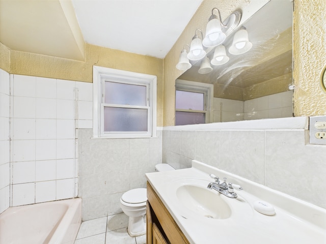 4931 S Knox Ave, Chicago, IL 60632 - bathroom with tile walls, a tub, vanity, and tile patterned floors