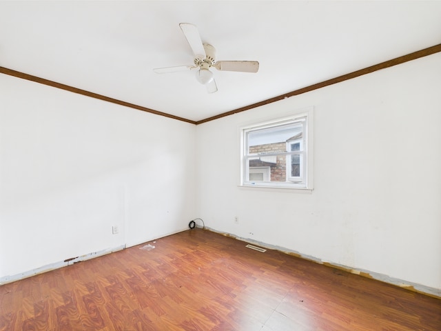 4931 S Knox Ave, Chicago, IL 60632 - empty room with ornamental molding, wood finished floors, and a ceiling fan
