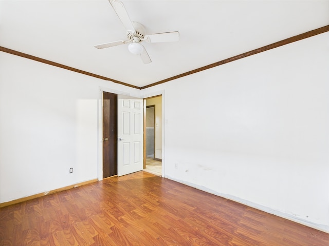 4931 S Knox Ave, Chicago, IL 60632 - spare room with wood finished floors, crown molding, and a ceiling fan