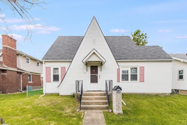 657 1st St, Crete, IL 60417 - view of front of home with a front yard and roof with shingles