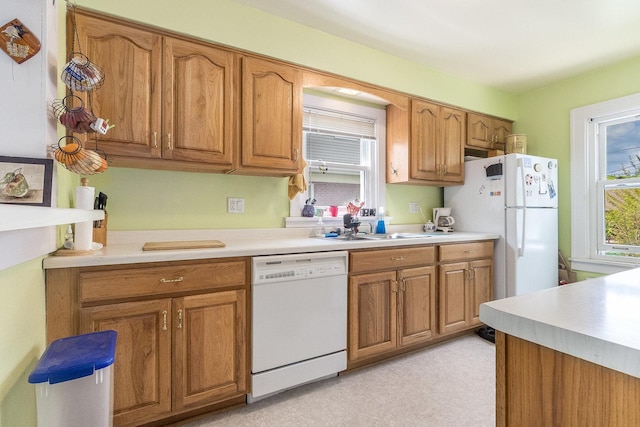 657 1st St, Crete, IL 60417 - kitchen with white appliances, brown cabinetry, and light countertops
