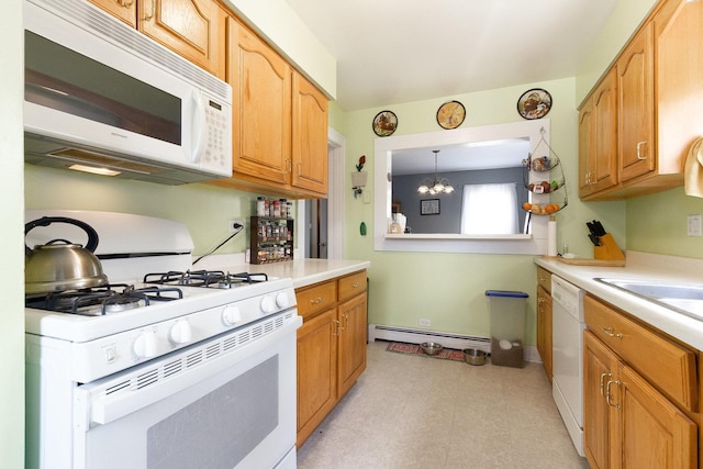 657 1st St, Crete, IL 60417 - kitchen featuring white appliances, a baseboard radiator, light countertops, a chandelier, and light floors