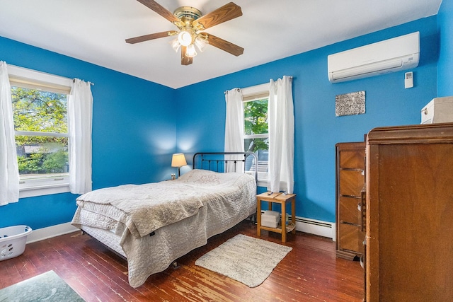 657 1st St, Crete, IL 60417 - bedroom with a wall mounted AC, wood-type flooring, a baseboard heating unit, and a ceiling fan