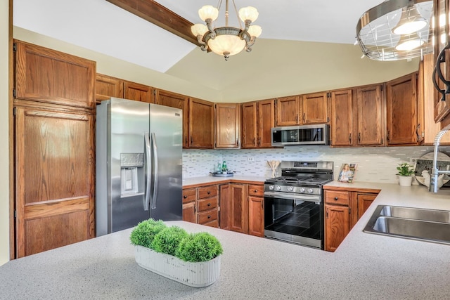 12976 W 21st St, Wadsworth, IL 60083 - kitchen featuring appliances with stainless steel finishes, a chandelier, light countertops, brown cabinetry, and tasteful backsplash