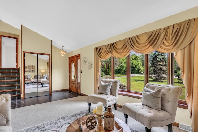 12976 W 21st St, Wadsworth, IL 60083 - living room featuring a chandelier and vaulted ceiling
