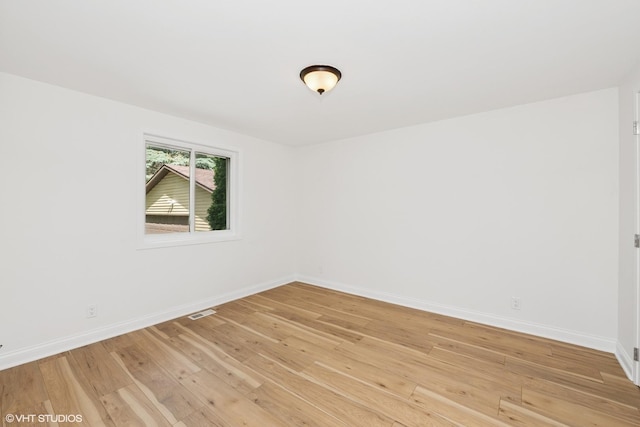 104 Hastings Way SW, Poplar Grove, IL 61065 - spare room with baseboards and light wood-type flooring