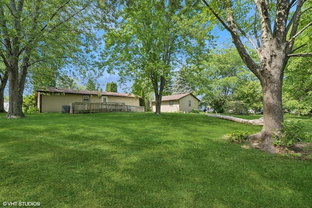 104 Hastings Way SW, Poplar Grove, IL 61065 - view of green lawn featuring a wooden deck
