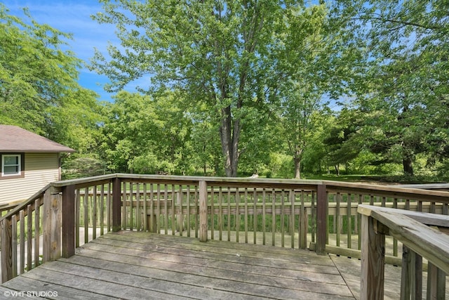 104 Hastings Way SW, Poplar Grove, IL 61065 - wooden terrace with view of wooded area