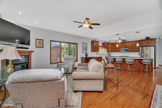 11186 188th Pl, Mokena, IL 60448 - living area featuring a ceiling fan, light wood-type flooring, a glass covered fireplace, and recessed lighting