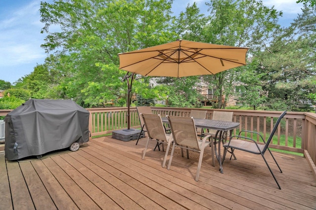 11186 188th Pl, Mokena, IL 60448 - wooden deck with outdoor dining space, a grill, and view of wooded area
