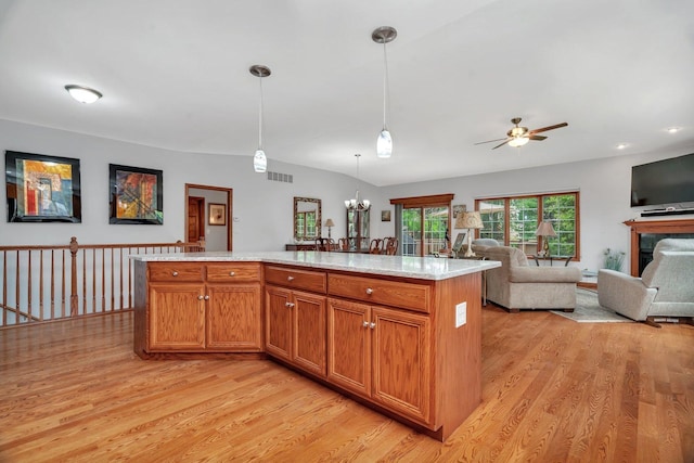 11186 188th Pl, Mokena, IL 60448 - kitchen featuring light wood-style floors, a ceiling fan, hanging light fixtures, and open floor plan