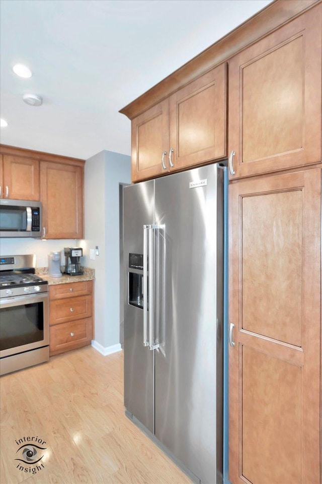 14727 Central Park Ave, Midlothian, IL 60445 - kitchen with stainless steel appliances, light wood finished floors, recessed lighting, and brown cabinets