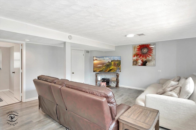 14727 Central Park Ave, Midlothian, IL 60445 - living area featuring light wood finished floors and a textured ceiling