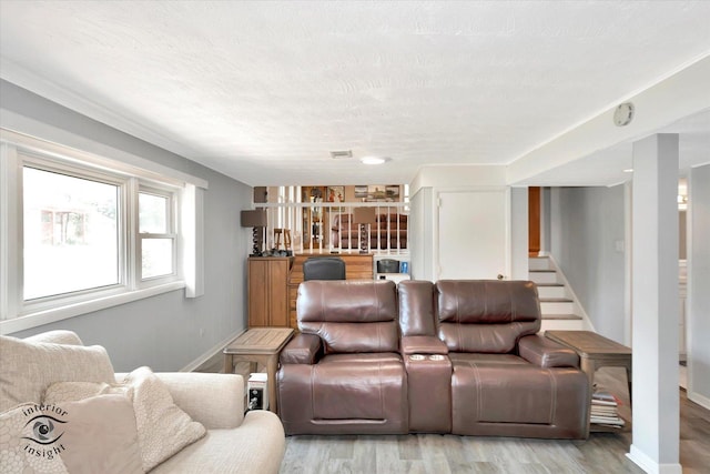 14727 Central Park Ave, Midlothian, IL 60445 - living area with light wood finished floors, stairway, and a textured ceiling