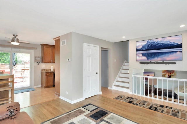14727 Central Park Ave, Midlothian, IL 60445 - living area featuring light wood-type flooring, a ceiling fan, recessed lighting, and stairs