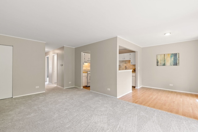 403 Sandalwood Ln Unit C1, Schaumburg, IL 60193 - unfurnished living room featuring baseboards and light carpet