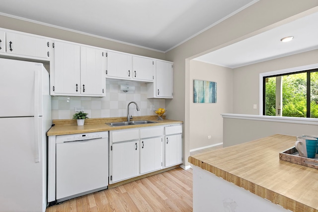 403 Sandalwood Ln Unit C1, Schaumburg, IL 60193 - kitchen with white appliances, backsplash, light wood-style flooring, light countertops, and white cabinetry