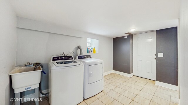 8211 S Cornell Ave, Chicago, IL 60617 - laundry area featuring washer and dryer and light tile patterned flooring