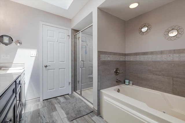 13907 W Big Run Ln, Homer Glen, IL 60491 - bathroom with a bath, vanity, a shower stall, a skylight, and wood finished floors
