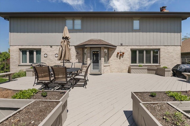13907 W Big Run Ln, Homer Glen, IL 60491 - rear view of property with brick siding, a wooden deck, a chimney, and outdoor dining area