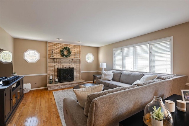 13907 W Big Run Ln, Homer Glen, IL 60491 - living area featuring a fireplace and light wood-style floors