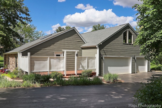 1504 N Denali Trl, Mchenry, IL 60050 - view of front facade featuring driveway, an attached garage, and roof with shingles