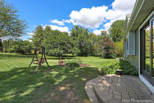 1504 N Denali Trl, Mchenry, IL 60050 - view of grassy yard with a patio and view of wooded area