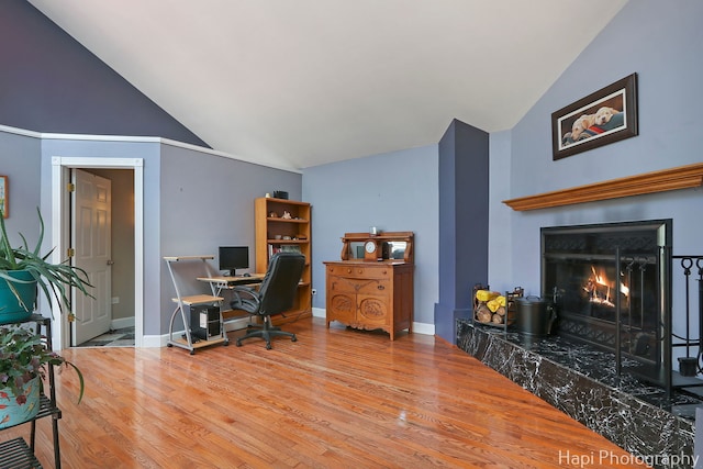 1504 N Denali Trl, Mchenry, IL 60050 - office area featuring wood finished floors, high vaulted ceiling, and a lit fireplace