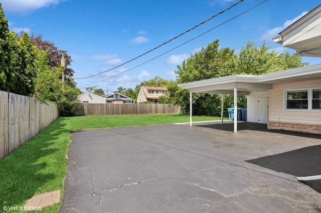 14928 Millard Ave, Midlothian, IL 60445 - view of patio / terrace featuring driveway and an attached carport