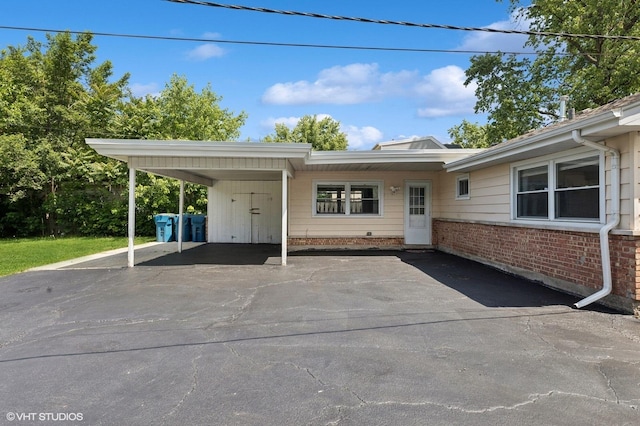 14928 Millard Ave, Midlothian, IL 60445 - view of front of home featuring driveway, a carport, and brick siding