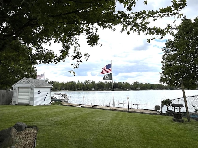 1905 E Grand Ave, Lindenhurst, IL 60046 - view of grassy yard with a boat dock, a water view, and a storage unit