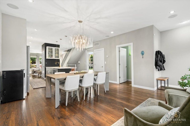 3800 N Christiana Ave, Chicago, IL 60618 - dining space featuring a chandelier, dark wood finished floors, and recessed lighting
