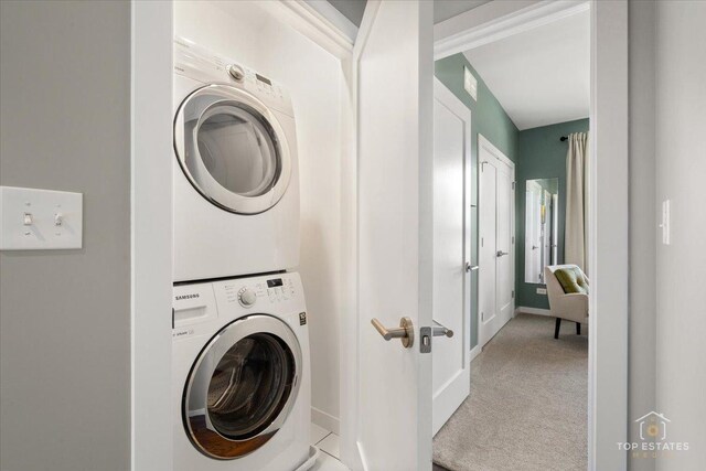 3800 N Christiana Ave, Chicago, IL 60618 - laundry area with stacked washer / dryer and light colored carpet
